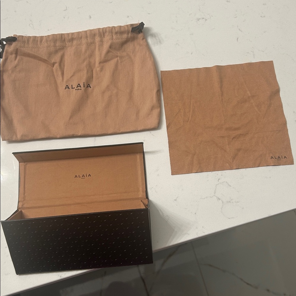 Alaia sunglasses case with dusty and small sunglasses bag.
